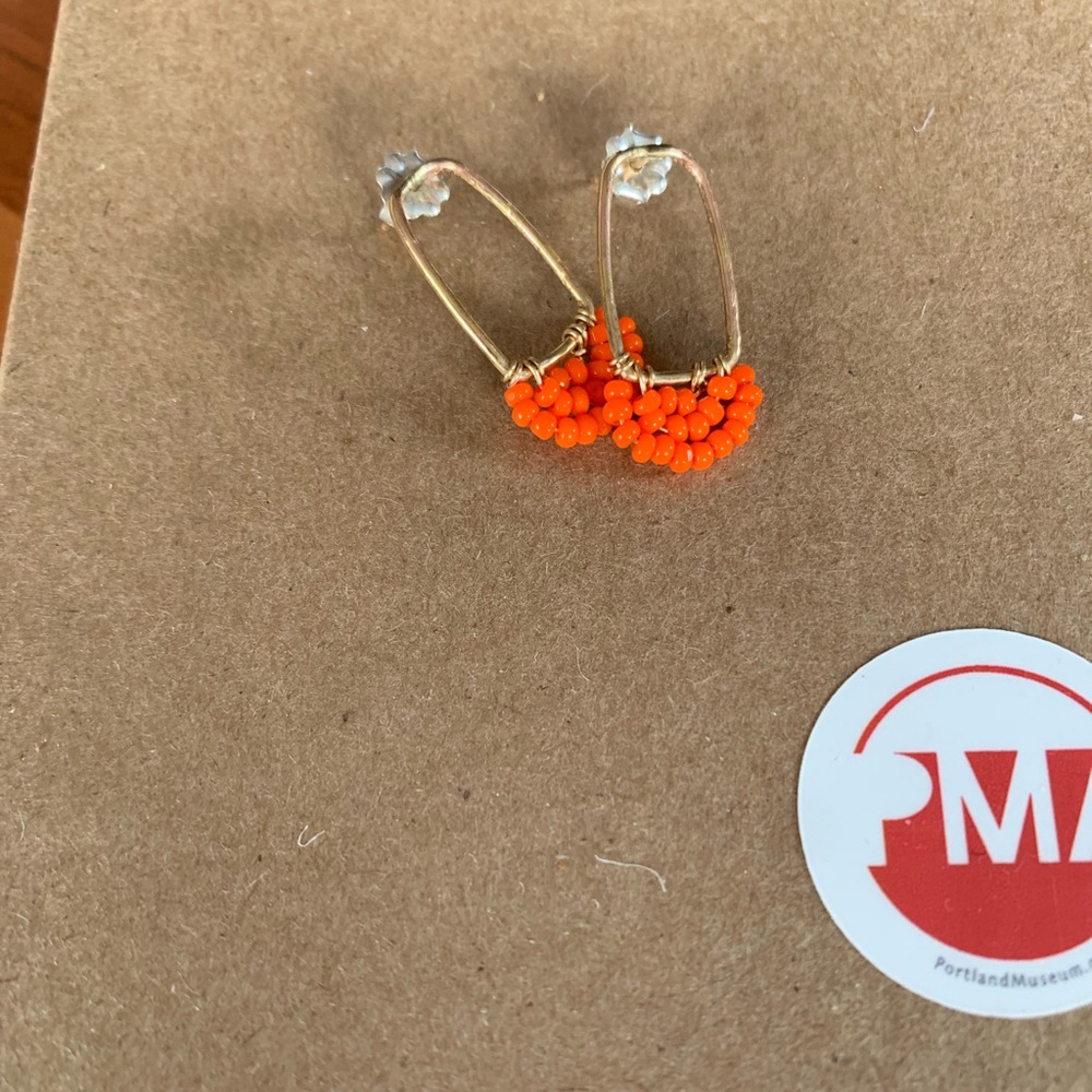Orange beaded gold stud earrings. Never been worn.